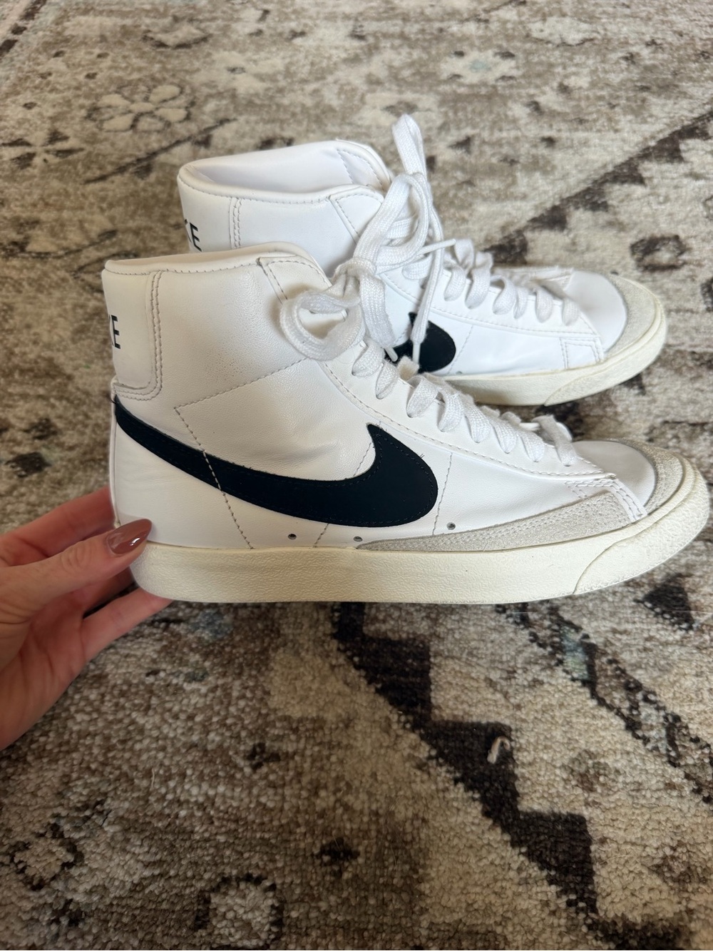 Nike White High-Top Sneakers with Black Swoosh